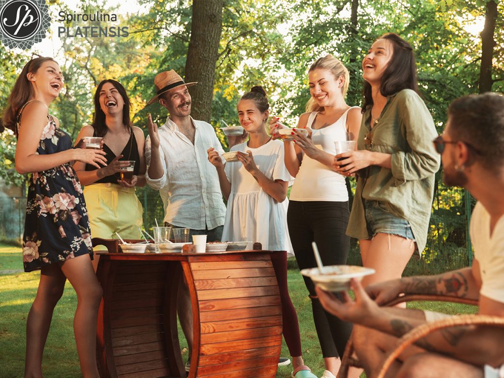 happy friends eating drinking beers barbecue dinner sunset time easter