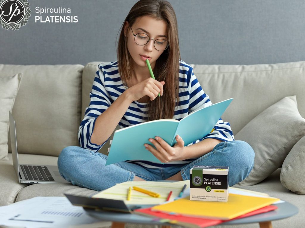 Tips to not gain weight until the exams! studying online concept serious young woman being busy with remote site